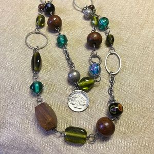 Mixed metal, glass and wood beaded necklace.
